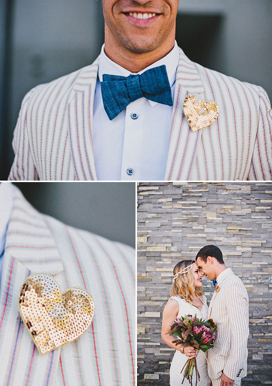 Stylish groom wearing a striped suit with a sequined heart pin