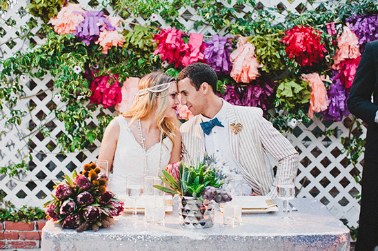 Romantic couple at wedding with colorful flower decorations