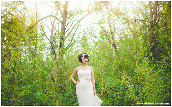 A bride in Austin, Texas stands in the trees.