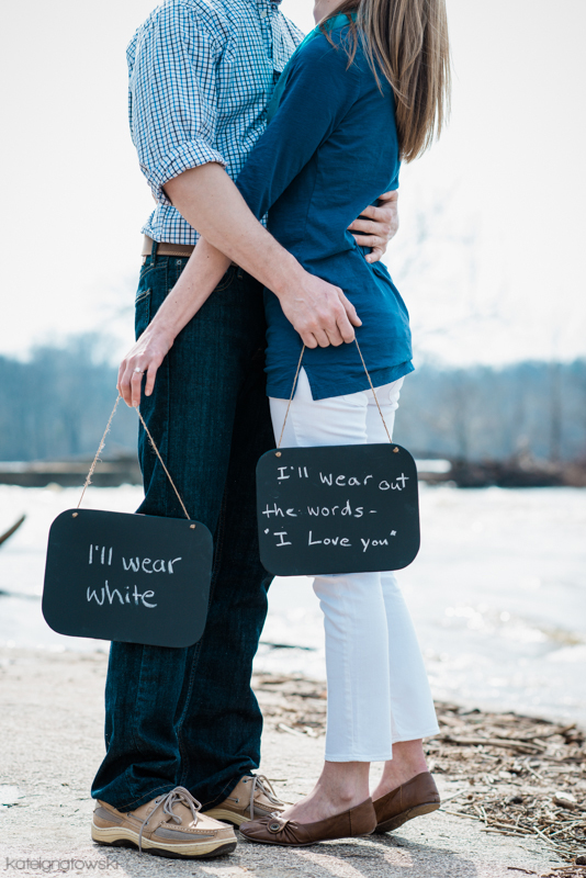 Couple hugging with chalkboards saying I love you, wedding vows