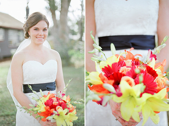 Bride in white dress holding vibrant flower bouquet