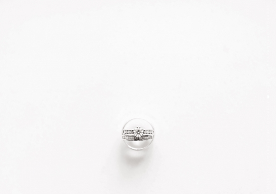 Elegant wedding rings with diamonds set on a white background