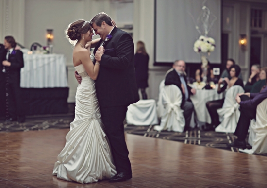 Bride and groom share a romantic first dance at their wedding reception
