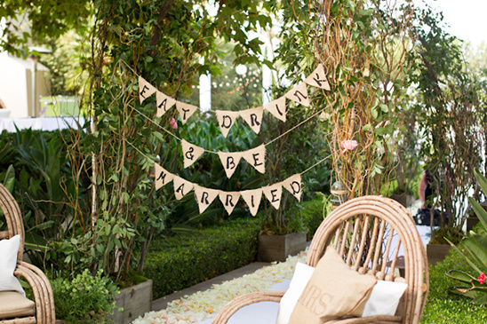 Wedding decor with Eat Drink & Be Married sign and chairs