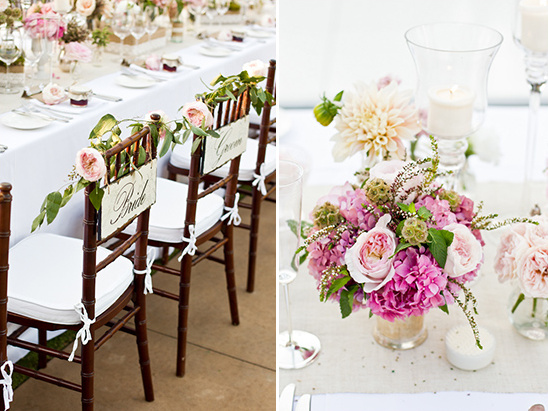 Romantic wedding decor with floral centerpieces and bride groom chairs