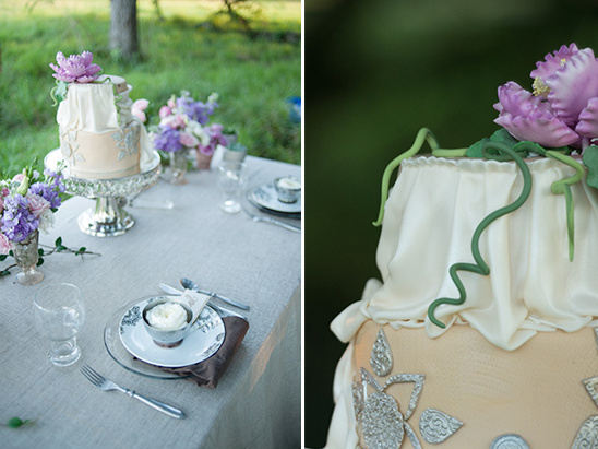 Elegant wedding cake with floral decorations on outdoor table setting