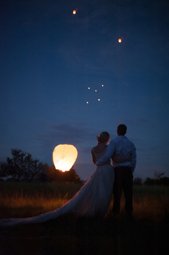 Couple watches lanterns rise on their wedding night