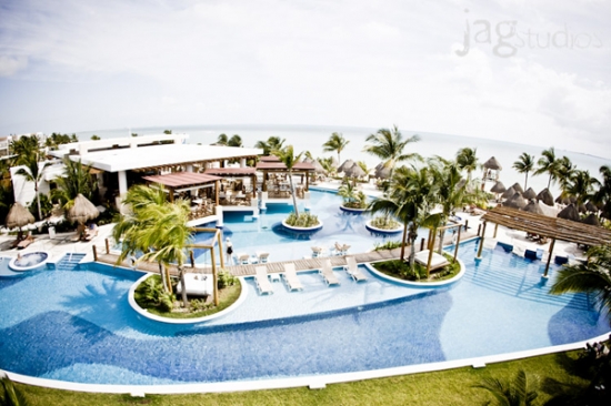 Tropical resort with pools and ocean views on a sunny day