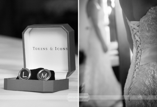 Wedding cufflinks in a box next to a bride's dress in black and white