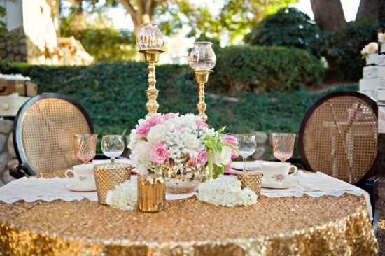 Elegant outdoor wedding table with gold sequin tablecloth