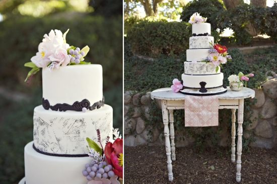 Elegant tiered wedding cake with floral decorations on outdoor display