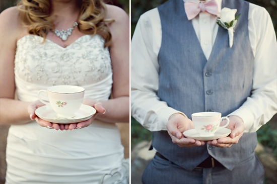 Bride and groom holding teacups at their wedding celebration