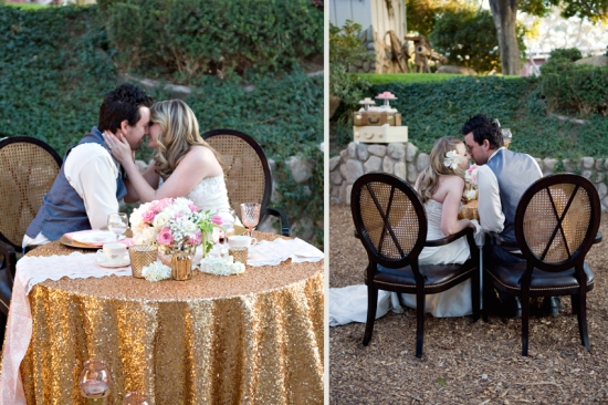 Romantic wedding couple sharing a tender kiss at the table