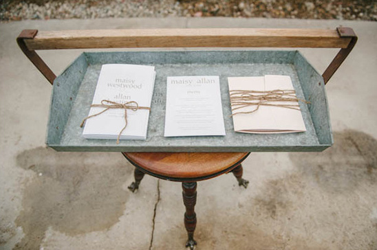 Wedding programs in tray on small table closeup