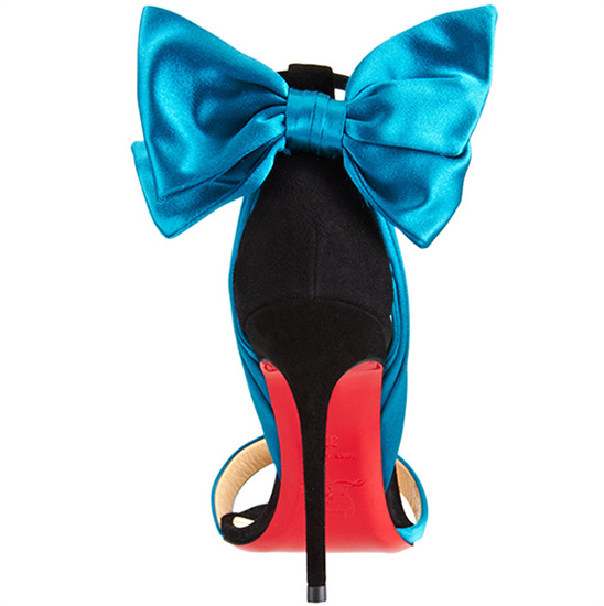 Elegant teal bow high heels with red soles