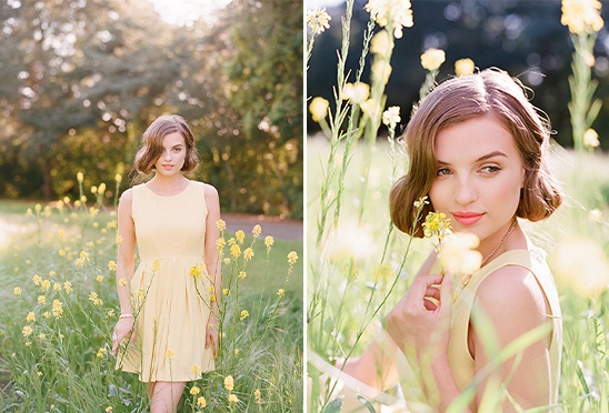 Young woman in yellow dress posing in a flower field