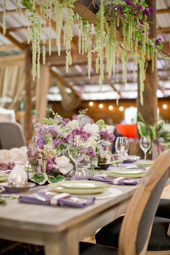 Rustic wedding table centerpiece with purple flowers