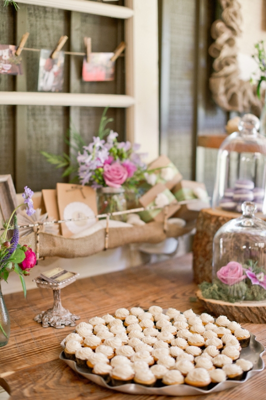 Rustic wedding dessert table with mini cupcakes