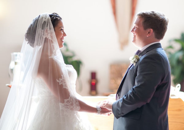 Bride and groom smiling at their wedding ceremony