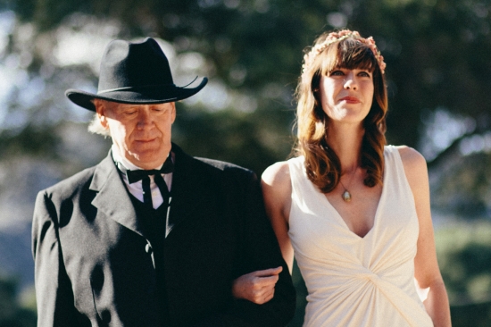 Father of the bride leading daughter to wedding