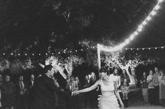 Couple dancing at night wedding party