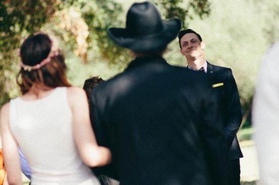Man in suit watching wedding
