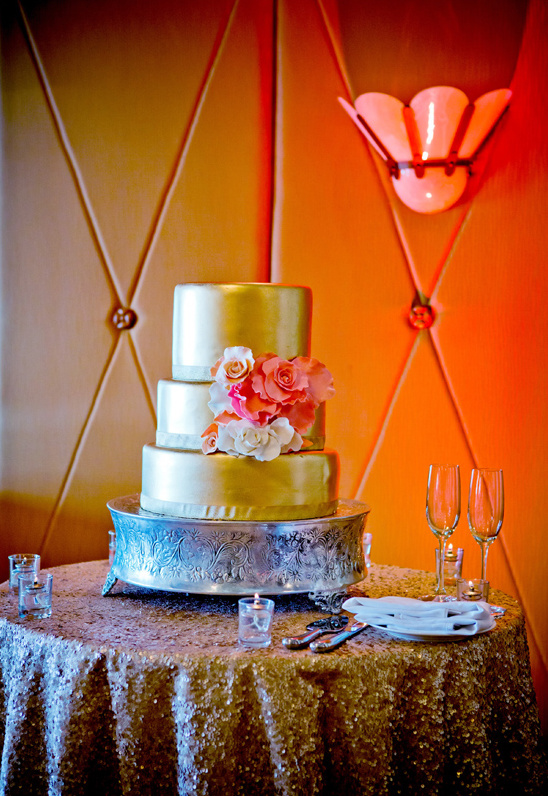 gold wedding cake by La Valencia Hotel