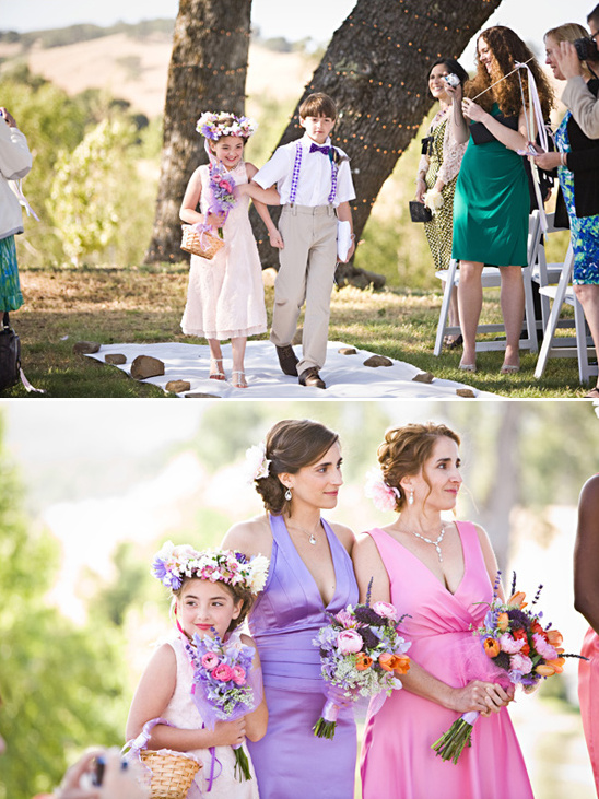 Adorable flower girls and ring bearer walking down aisle