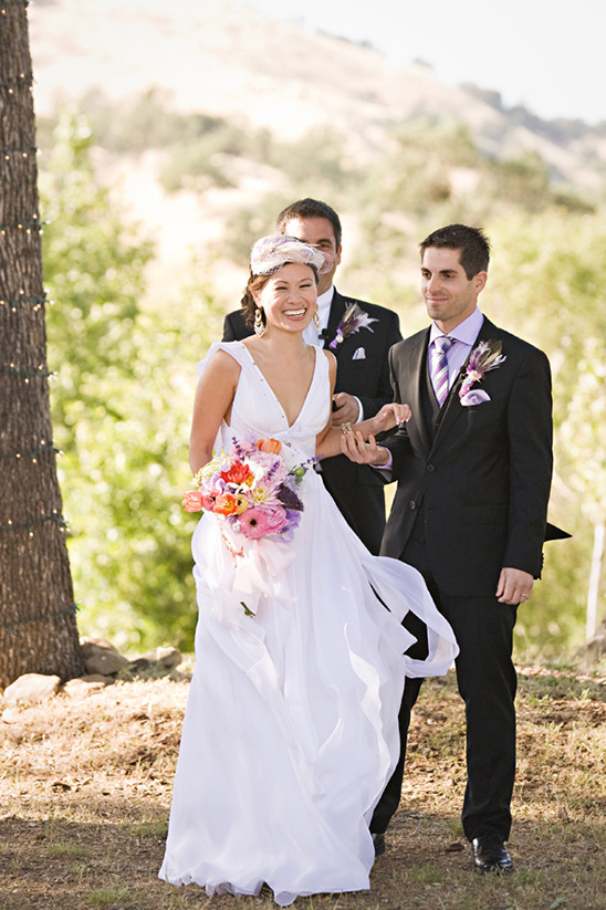 Bride walking down aisle, happy couple