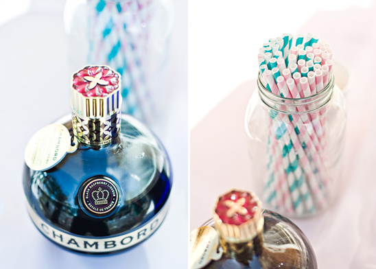 Chambord bottle with striped straws in mason jar party