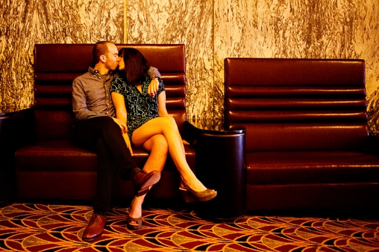 Couple kissing on vintage couch, romantic date