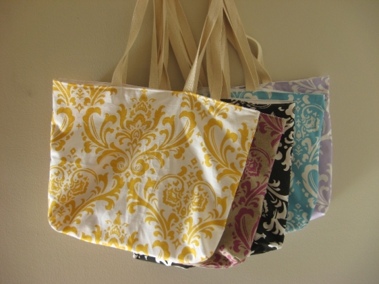 Colorful damask tote bags hanging on the wall for sale
