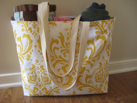Tote bag with yellow floral pattern and cloth handles