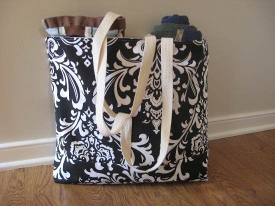 Black and white damask tote bag with towels inside