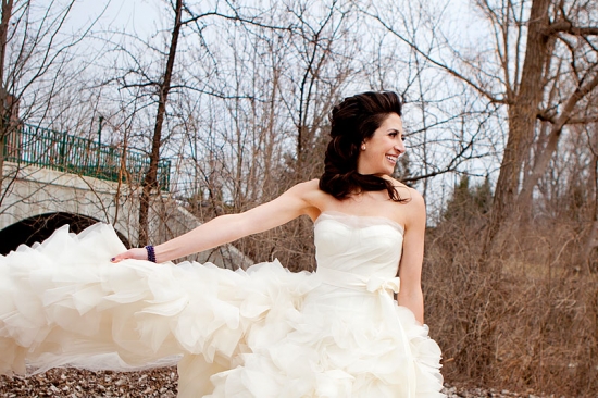 Bride in flowing white wedding dress outdoors