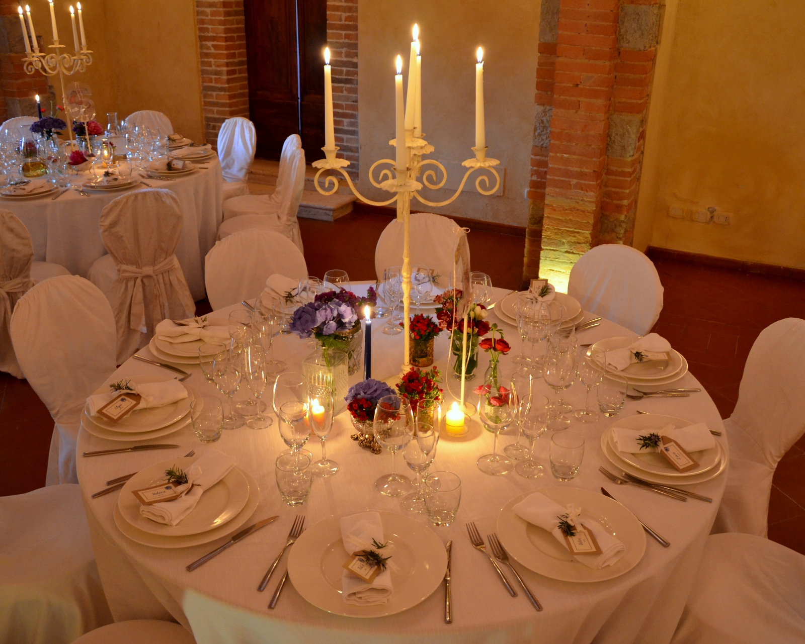 Elegant wedding reception table setting with candlelight