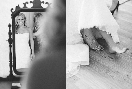 Bride trying on wedding dress with mother