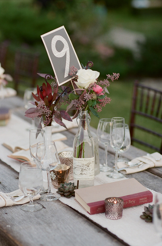 Wedding table decor with table number nine floral centerpiece