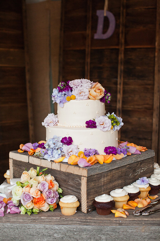peach and purple wedding cake by Mazzetti's Bakery