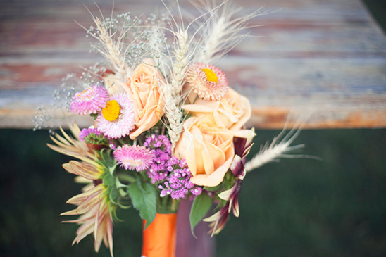 Pretty peach roses and wildflowers bouquet