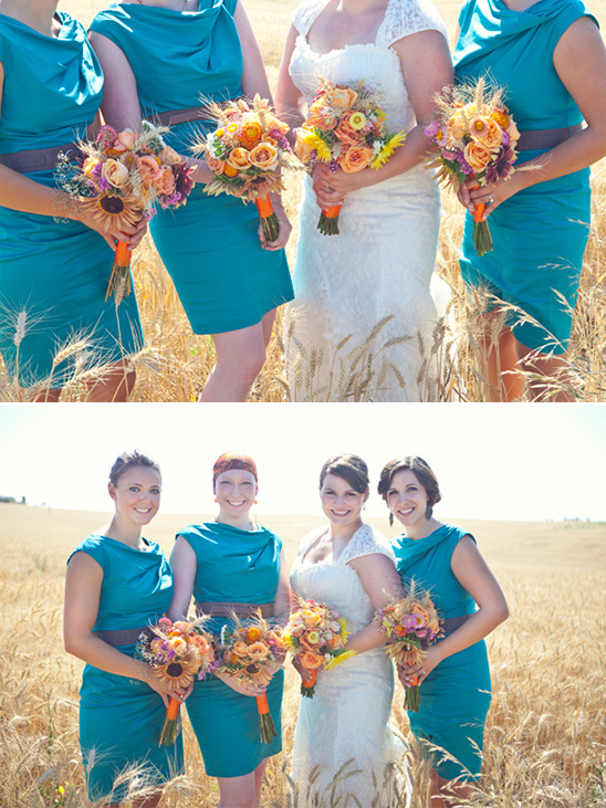 Bride bridesmaids bouquets in wheat field at wedding