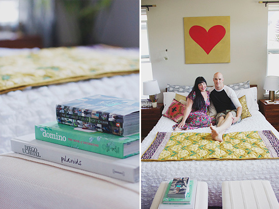 Couple relaxing on a stylishly decorated bed with books