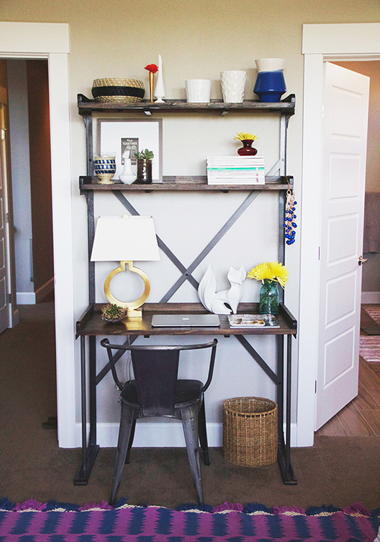 Rustic industrial workspace with shelves and chair