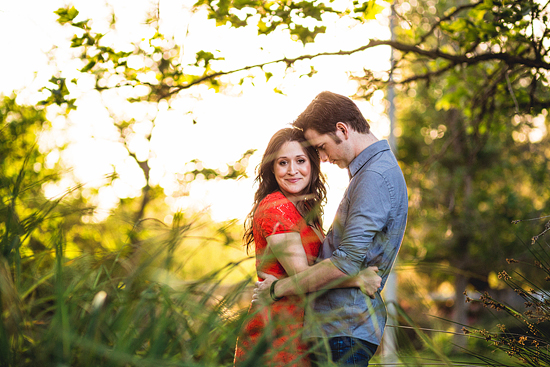 Romantic couple embracing in a sunny park