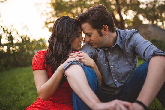 Romantic couple embracing outdoors, sunset