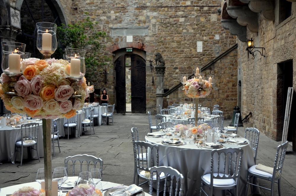 Romantic wedding reception in a stone courtyard setting