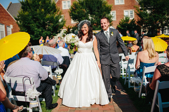 Bride and groom walking down aisle at wedding ceremony