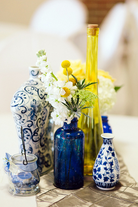 Blue and white vase centerpiece with yellow flowers