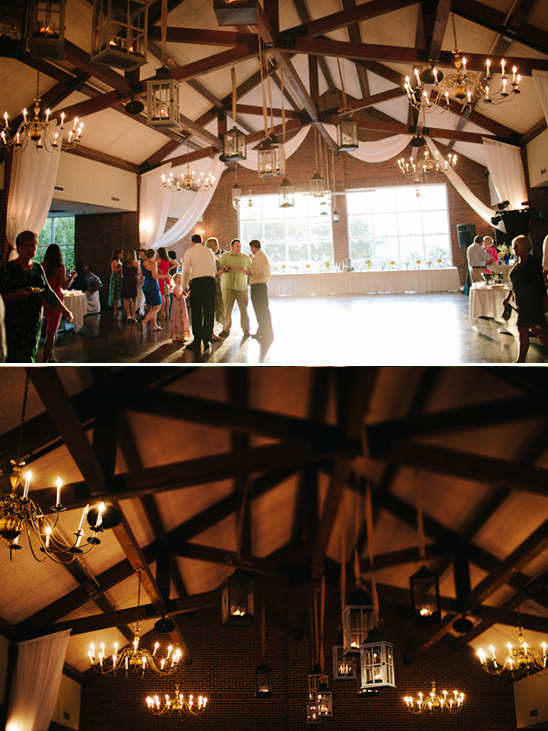 Wedding reception hall with lanterns and chandeliers