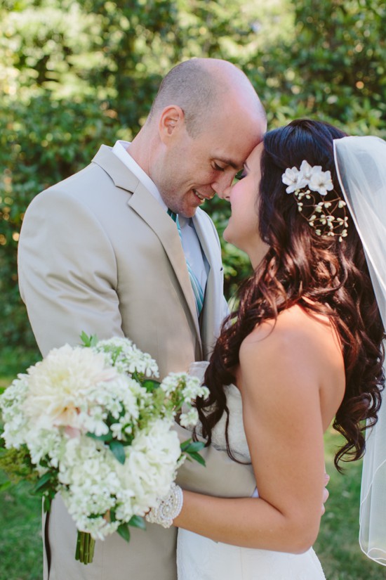 Bride and groom forehead to forehead on their wedding day